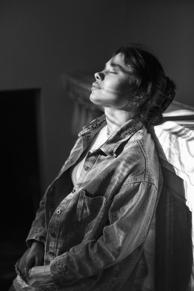black white analog portrait woman posing indoors